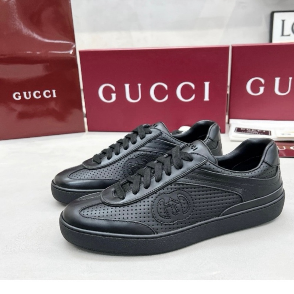 Authentic Gucci Black Leather Sneakers with Embossed Pattern